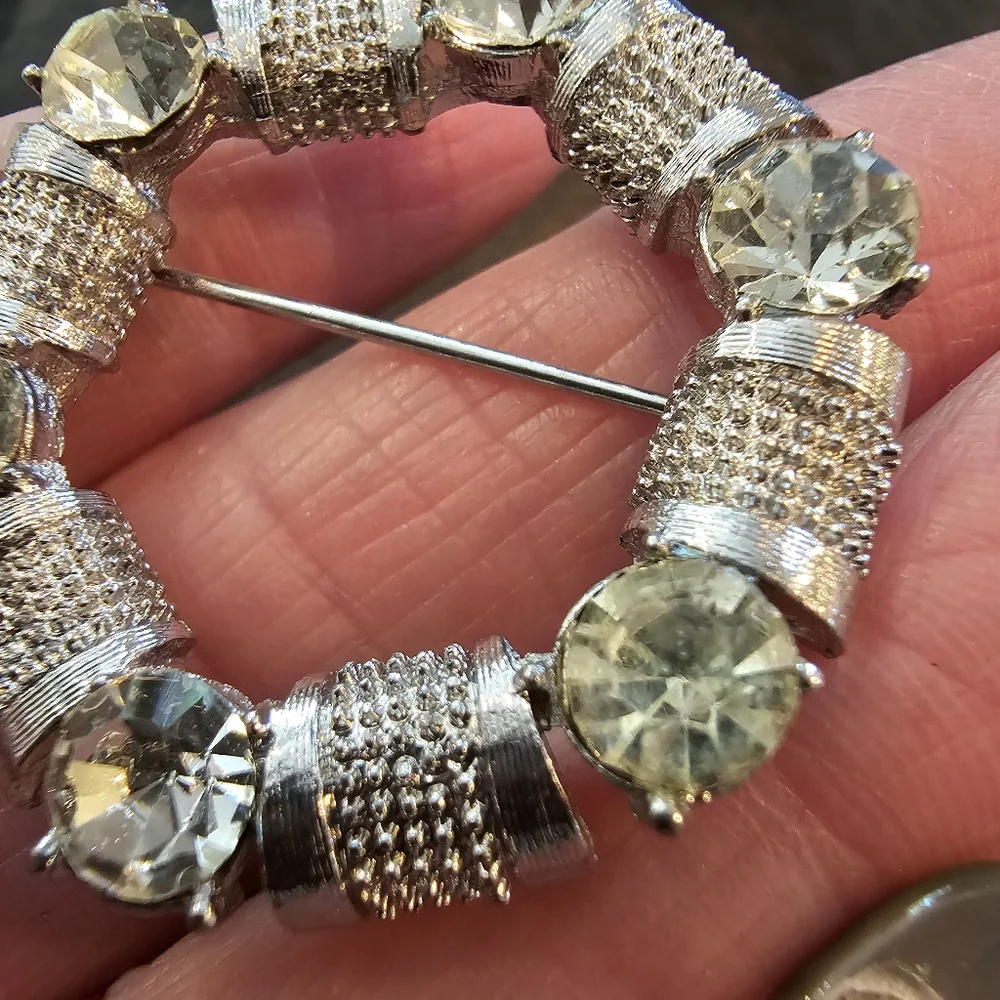 Vintage silvertone and Rhinestone circular brooch
